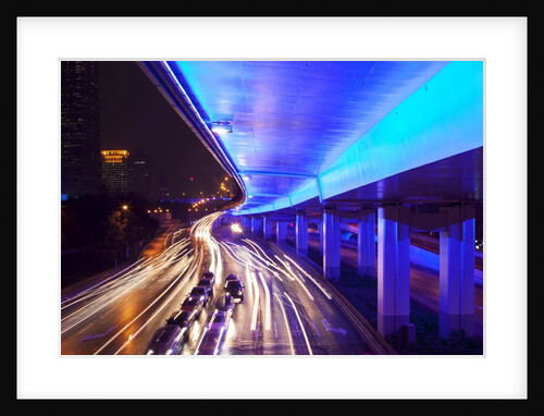 Traffic beneath neon-lit elevated road by Anonymous