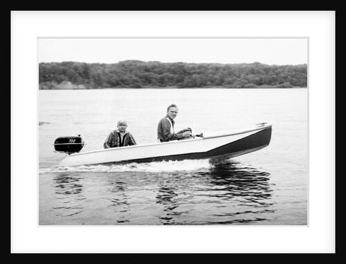 Two brothers speed by in a motor boat on a Wisconsin lake, ca. 1956 by Anonymous