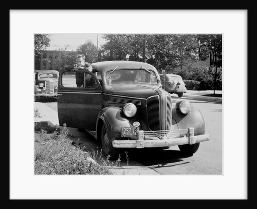 Eighteen year old boy with his first car, ca. 1944 by Anonymous