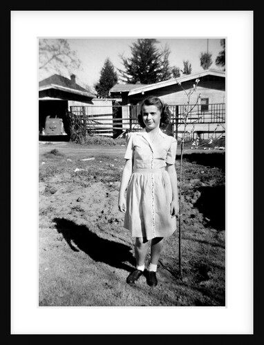 A teenage girl poses in front of her California house, ca. 1942 by Anonymous