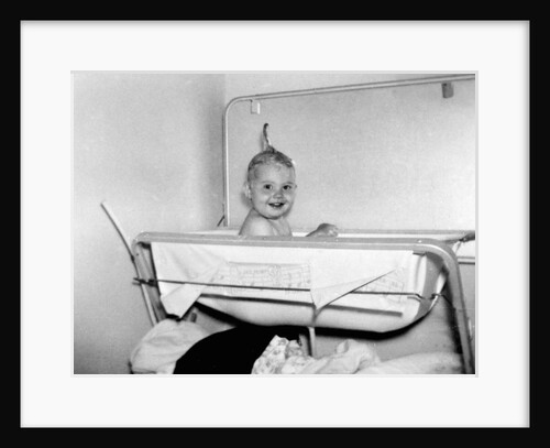 One year old baby girl enjoys her bath, ca. 1953 by Anonymous