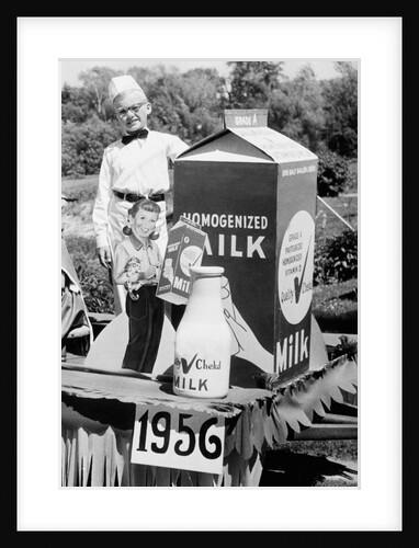 Ten year old boy rides on a parade float promoting milk in Wisconsin, ca. 1956 by Anonymous