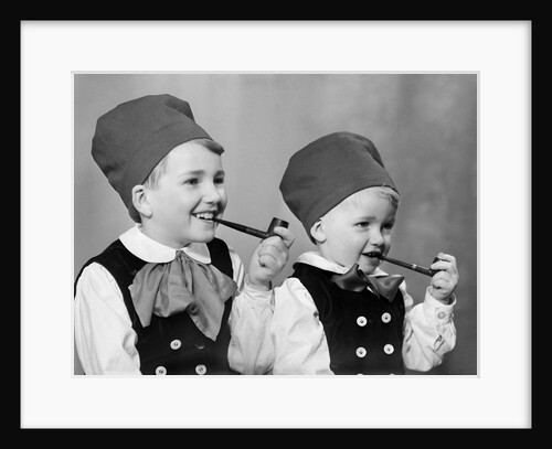 Two brothers in Bavarian costumes pretend to smoke pipes, ca. 1947 by Anonymous