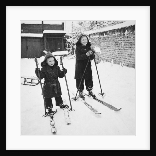 Two brothers stand on their skis in the snow, ca. 1950 by Anonymous