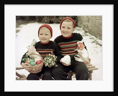 Two brothers sit with Easter decorations outside in Germany, ca. 1948 by Anonymous