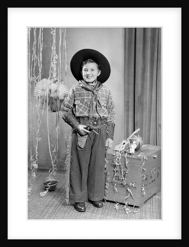 Ten-year-old boy poses in a cowboy outfit, ca. 1951 by Anonymous