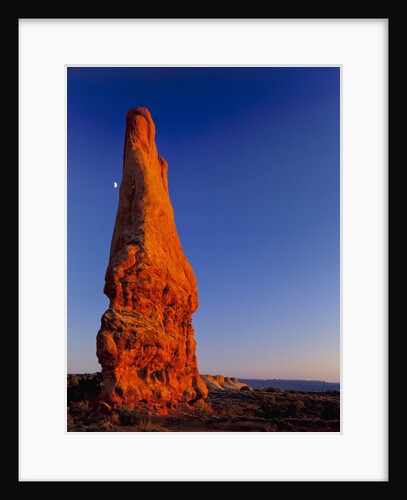 Moon and sandstone spire at Arches National Park by Anonymous