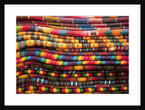 Textiles for sale in market in San Miguel de Allende by Anonymous