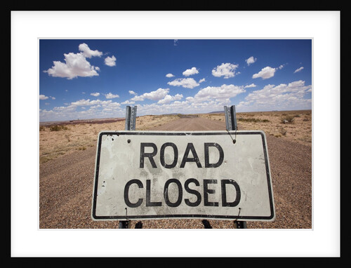 Road closed sign in desert by Anonymous