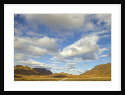 Cumulus clouds above tundra and mountains in Denali National Park by Anonymous