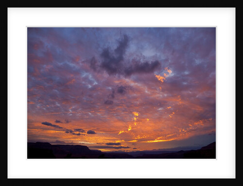Colored clouds above Colorado River at sunset by Anonymous