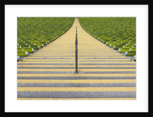 Stadium stairway between rows of green seats by Anonymous