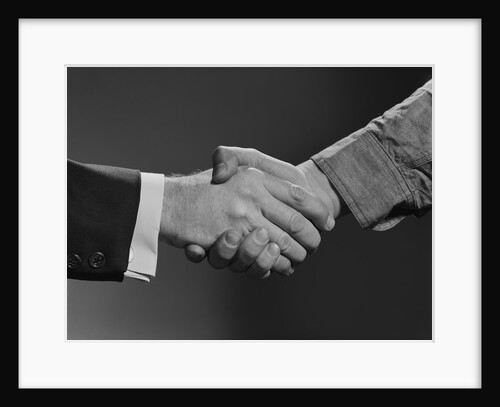 Close-up handshake between businessman and laborer by Anonymous