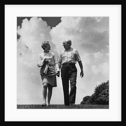 Mature couple walking holding hands by Anonymous