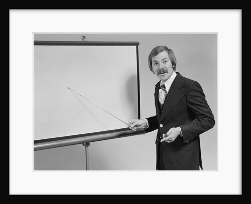 Young man speaking pointing to blank slide screen for presentation by Anonymous