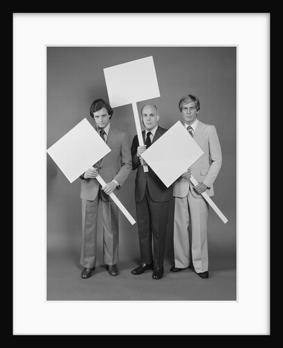 Trio of businessmen carrying blank signs by Anonymous