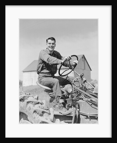 Smiling man farmer driving tractor by Anonymous