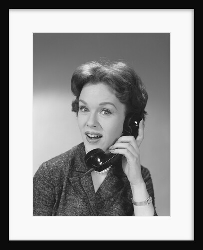 Happy smiling woman having telephone conversation by Anonymous