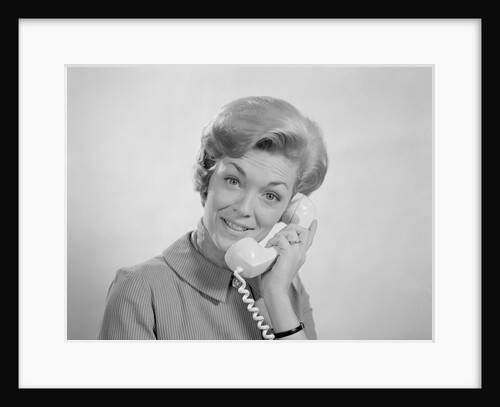 Portrait smiling woman talking on telephone by Anonymous