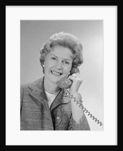 Portrait smiling mature woman talking on telephone by Anonymous