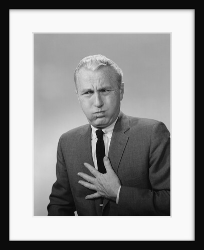 Man with heartburn nausea upset stomach distress by Anonymous