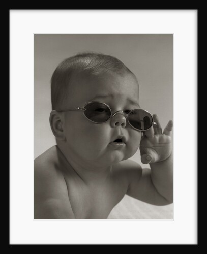 Baby wearing granny glasses sunglasses by Anonymous