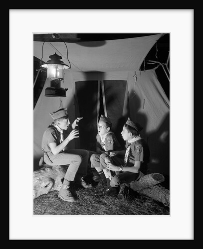 3 boy scouts sitting tent night telling ghost stories by Anonymous