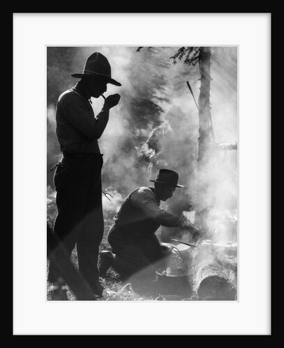 Three men cowboys camping one man smoking pipe one man cooking over campfire moody silhouette by Anonymous