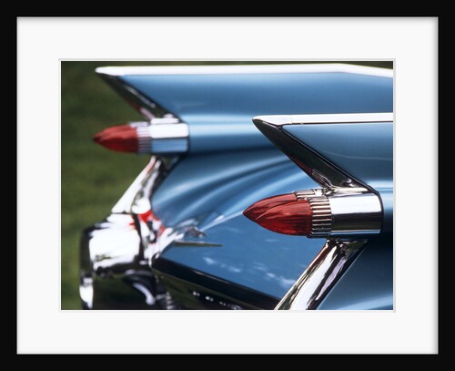 Detail fins rear tail lights blue cadillac auomobile by Anonymous
