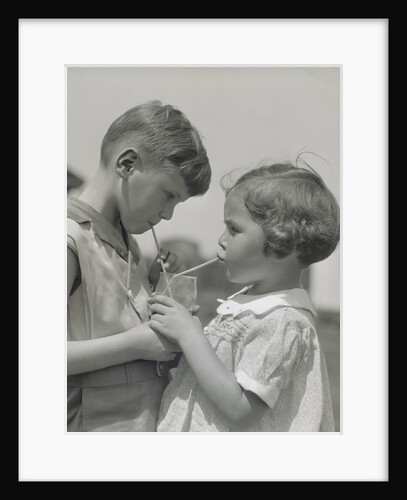 Children boy girl sharing drinking glass using straws by Anonymous