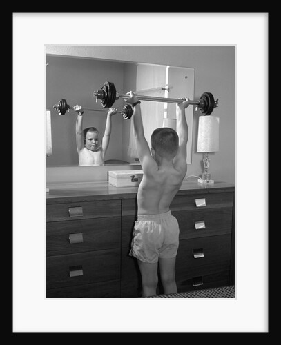 Boy exercising with dumbbell at mirror in bedroom by Anonymous