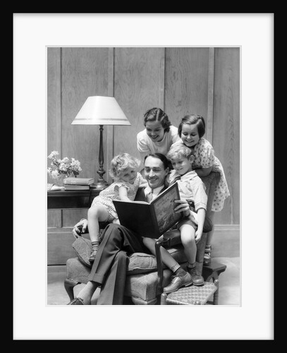 Father reading to family in chair by Anonymous