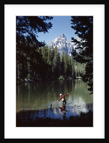Man fishing at string lake grand teton national park wyoming by Anonymous