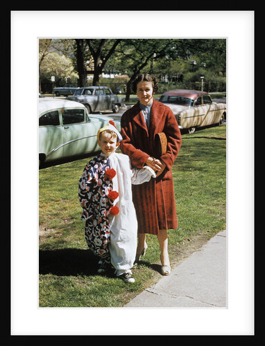 Mother with son dressed in clown suit outdoors by Anonymous