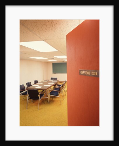Conference room interior with table chairs chalkboard open door ajar by Anonymous
