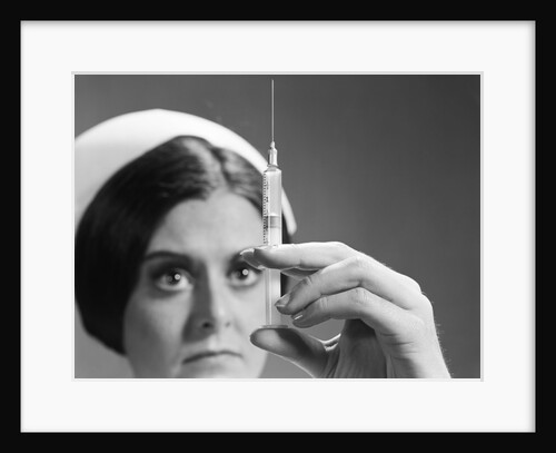 Nurse adjusting dosage injection hypodermic needle by Anonymous