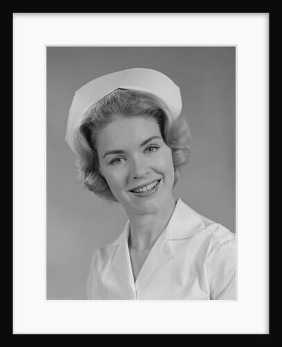 Female nurse smiling by Anonymous