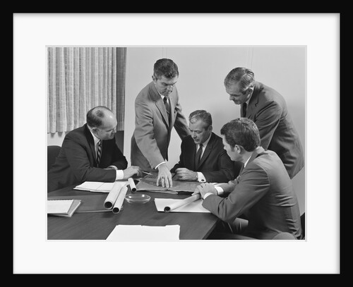 5 executive businessmen at conference table meeting looking over papers & blueprints by Anonymous