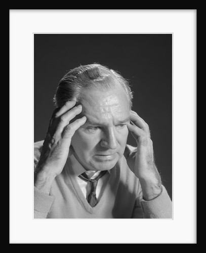 Older man with hands holding head temples by Anonymous