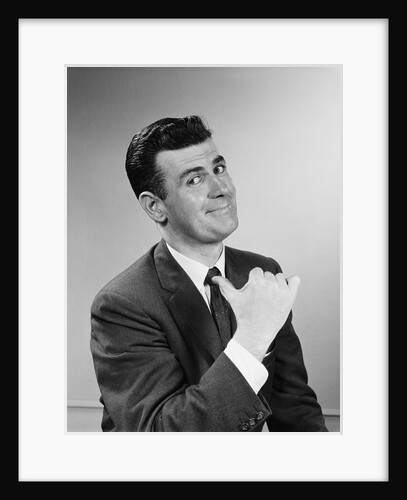 Business man smiling giving thumbs up sign pointing to himself by Anonymous