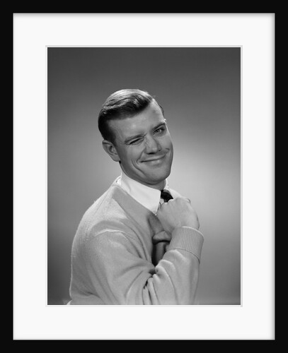 Smiling young man winking right eye and pointing proudly to himself by Anonymous
