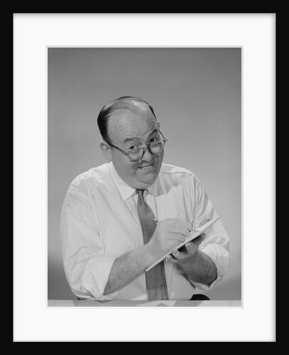 Balding businessman wearing eyeglasses shirt sleeves smiling writing notepad by Anonymous