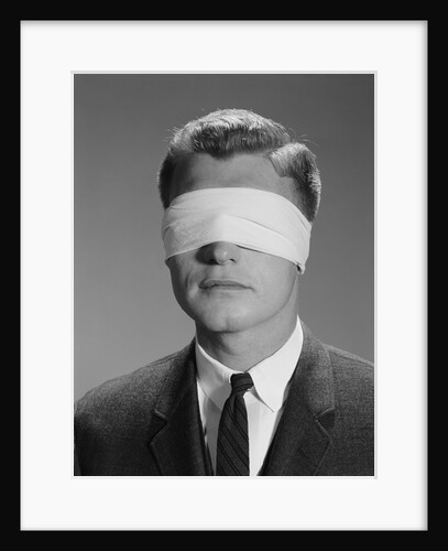 Young man wearing blindfold by Anonymous