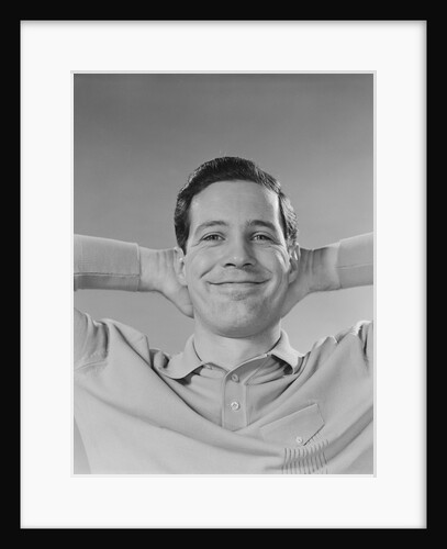 Man smiling relaxing with hands behind head by Anonymous