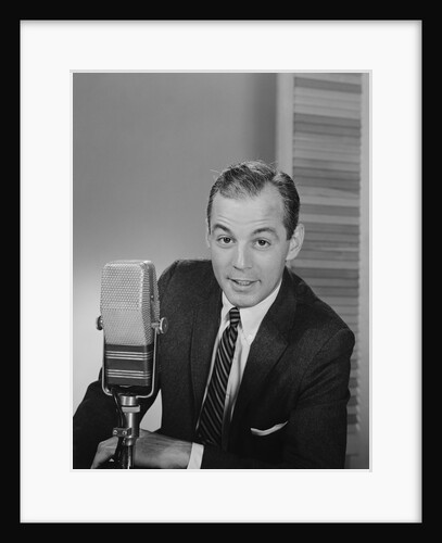Man speaking into microphone radio tv announcer broadcaster by Anonymous