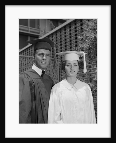 Graduation couple in cap and gown by Anonymous