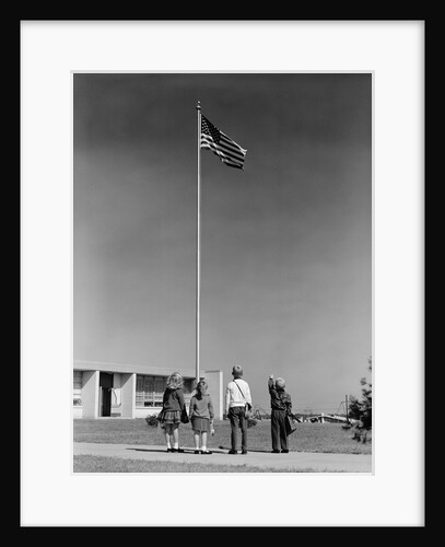 Group 4 school children looking up at american flag by Anonymous