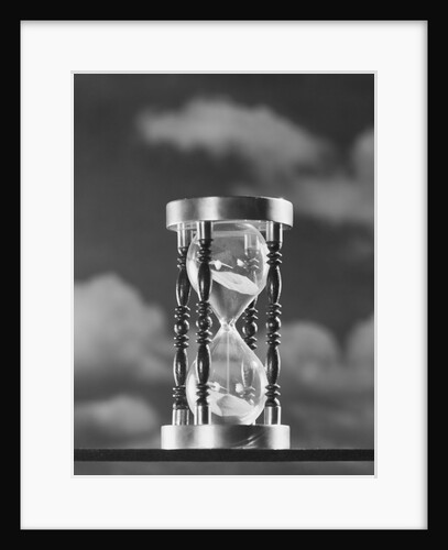 Hourglass against background of clouds by Anonymous