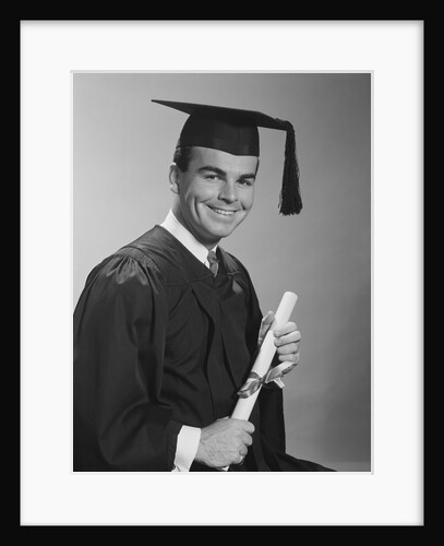 Smiling man holding diploma wearing graduation robes by Anonymous