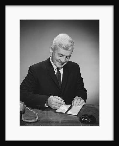 Man writing check from checkbook by Anonymous